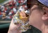 Woman eating hot dog Woman eating hot dog