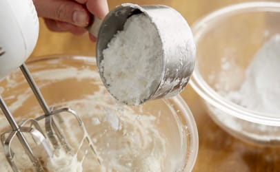 mixing flour into batter