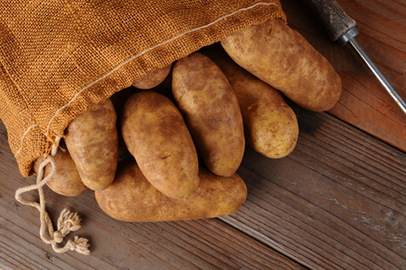 http://www.dreamstime.com/stock-photography-burlap-sack-potatoes-wood-image27793552