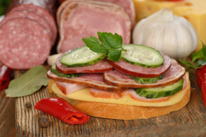 http://www.dreamstime.com/stock-image-sandwich-sausage-cucumber-brown-background-image48614061