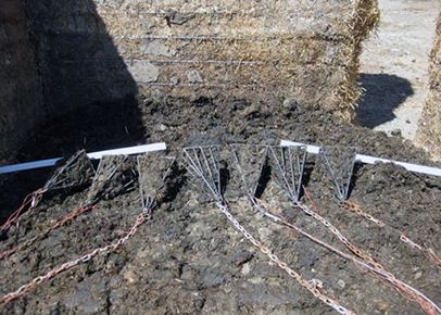 Retrieval pyramids filled with manure were placed at the bottom location of stockpiles. These pyramids allowed manure to be exposed to the hot conditions within the center of the pyramid, reducing bacterial survival and promoting the degradation of genes that code for antibiotic resistance.