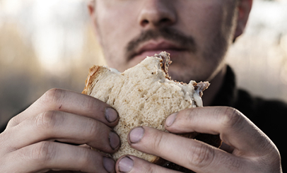 Eating sandwich with dirty hands