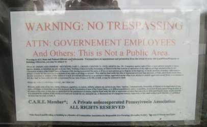 During a 2010 tour at Miller's Organic Farm, this photo of a trespass warning to the public and government was photographed.