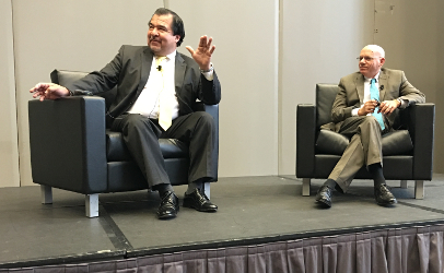 The USDA's Deputy Under Secretary for Food Safety Al Almanza, left, answers a question from the audience as FDA Deputy Commissioner for Foods and Veterinary Medicine Stephen Ostroff, right, listens. The two top food cops gave a U.S. regulatory update Monday afternoon at the annual conference of the International Association for Food Protection. About 3,000 people are registered for the four-day event in St. Louis. (Photo by Coral Beach)