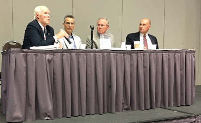 Discussing pros and cons of unpasteurized milk, from left, Theodore Beals, Jeffrey Farber, Jeff Kornacki and Joseph Heckman at the IAFP 2016 Conference in St. Louis.