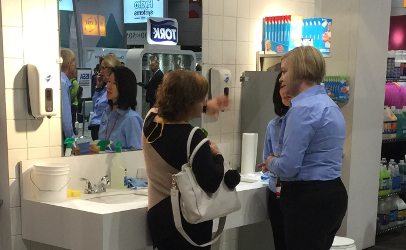 A company representative (above) discusses how the measurement of cleanliness is a reassuring reward to workers tasked with deep cleaning. After a simple spray and wipe procedure, workers can swab surfaces and use the scanner to measure, document and report successful cleaning. The system uses of each and a documented report of success. The system measures Relative Light Units using ATP, Adenosine TriPhosphate. (Photos by Jim Mann)