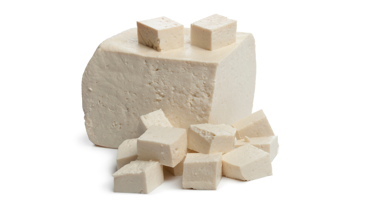 Fresh piece of tofu on white background