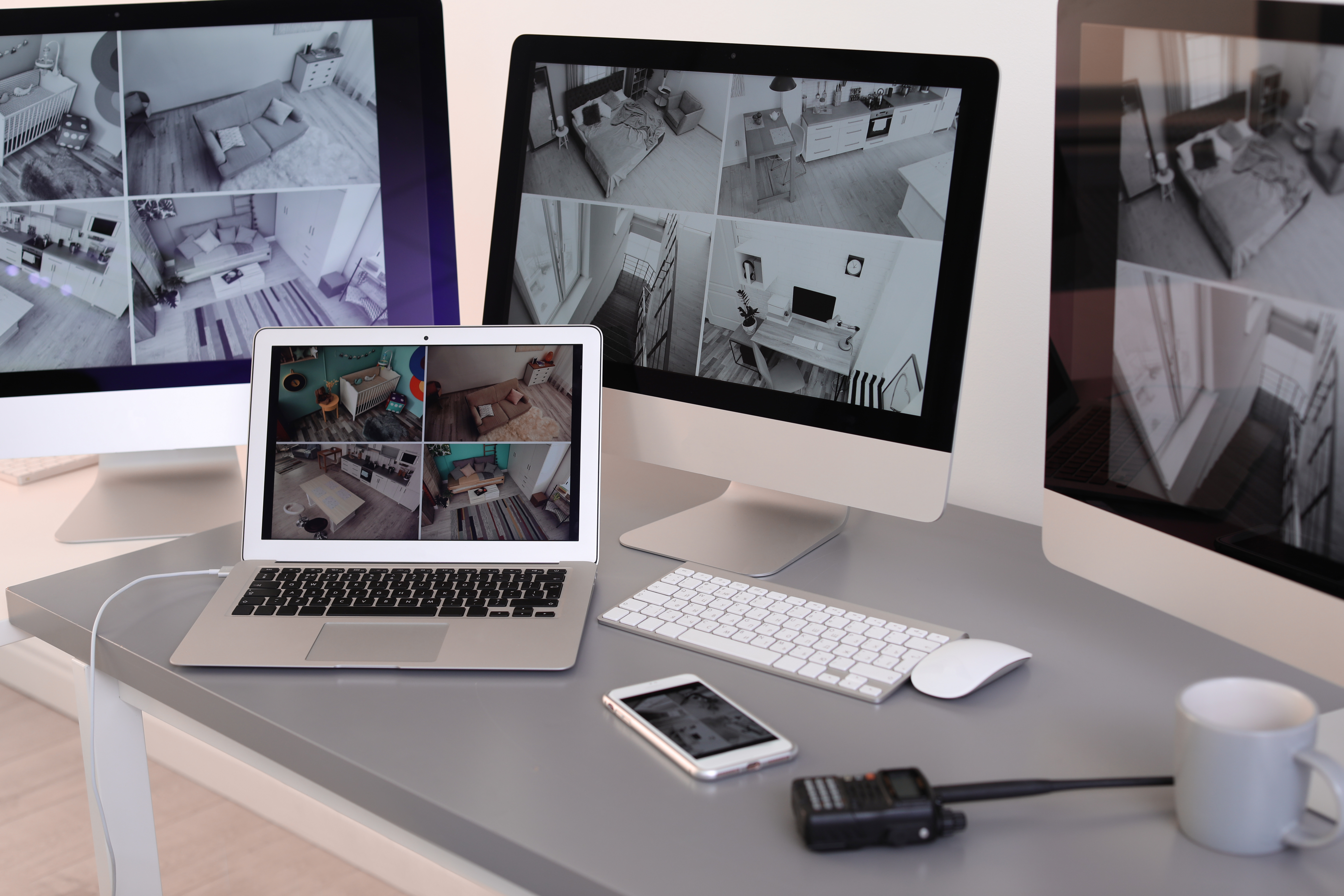 Modern computers with video broadcasting from security cameras at guard's workplace indoors